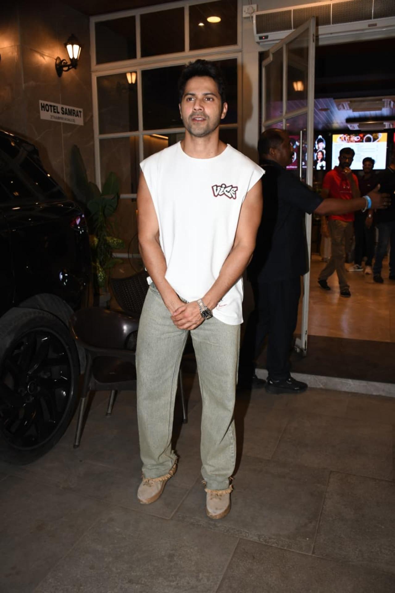 Varun Dhawan was spotted in a relaxed casual look as he stepped out in the city. The actor kept it cool in a sleeveless white T-shirt paired with loose grey trousers.